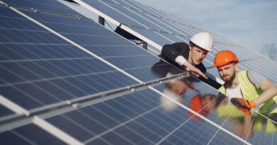 Foreman and businessman at solar energy station.